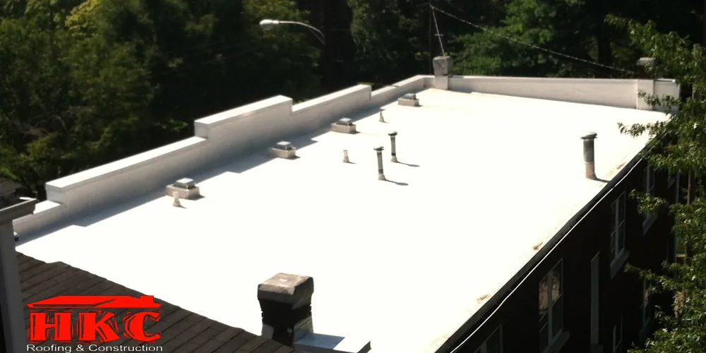 Flat membrane roof on a multi-story building, HKC Roofing & Construction