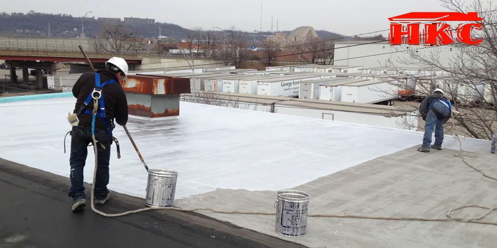 Roof coating over a commercial flat roof, HKC Roofing & Construction