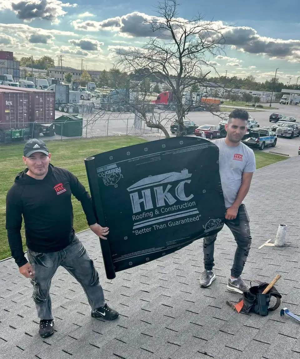 HKC Roofing & Construction crew on a commercial roofing job in Louisville